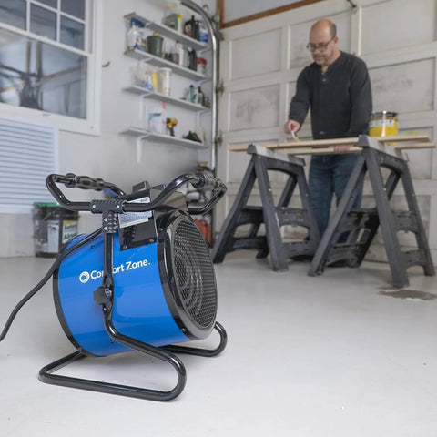 Powerful 3600 Watt 240 Volt Portable Industrial Heater with Steel Body in workshop with adjustable tilt thermostat and fan.