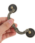 Hand holding Vintage Bail Drawer Pull Handles Two Pack Antique European Style Cabinet And Dresser Pulls 121mm showing design details