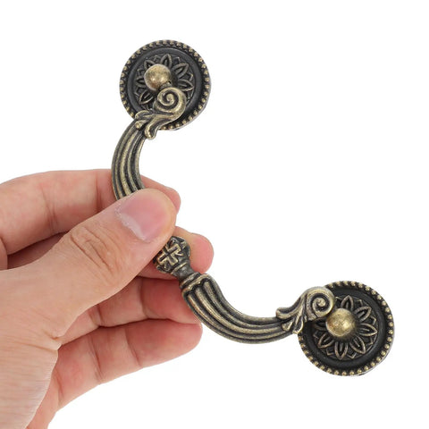 Hand holding Vintage Bail Drawer Pull Handles Set For Dressers And Cabinets, Antique Style Knobs, 121mm Rustic Decorative Hardware