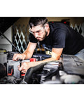 Man using Edge 155 Piece Master Mechanic's Tool Set with 72-Tooth Sealed Head Ratchet on car engine