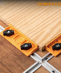 Universal T-Track Long Stop Kit for Woodworking with orange stops, black wing knobs, and wooden slabs aligned securely.