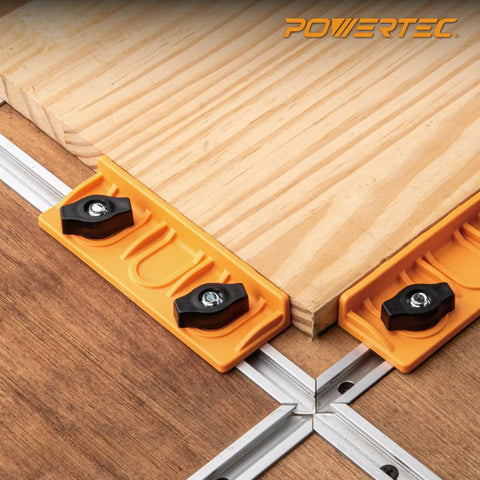 Universal T-Track Long Stop Kit for Woodworking with orange stops, black wing knobs, and wooden slabs aligned securely.