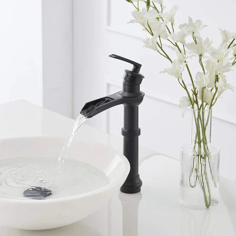 Dope Matte Black Vessel Sink Faucet With Waterfall Flow, Tall Single Hole Bathroom Vanity Mixer Tap beside white flowers