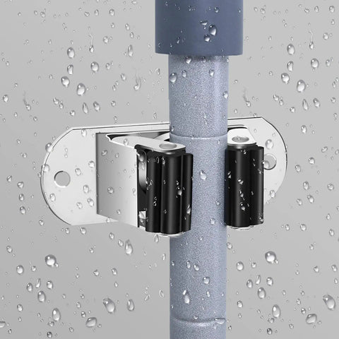 Heavy Duty Mop And Broom Wall Mount Organizer, Stainless Steel Tool Rack gripping a wet mop handle securely