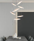 Modern Eight Led Ceiling Pendant Light With Warm Glow Handcrafted Solid Wood Shade Energy Saving Fixture hanging above a dining table.