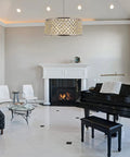 Madison Collection Ten Light Pendant With Royal Cut Clear Crystal Spheres over a black piano in a modern living room.