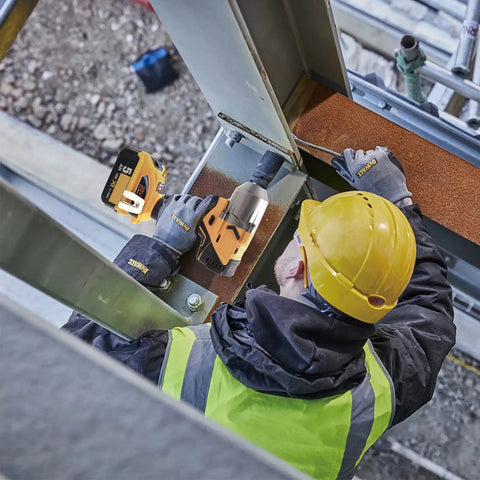 Worker using Beast Torque 500 Foot Pounds 20V Cordless Half Inch Brushless Impact Wrench With 4 Speed Settings on construction site