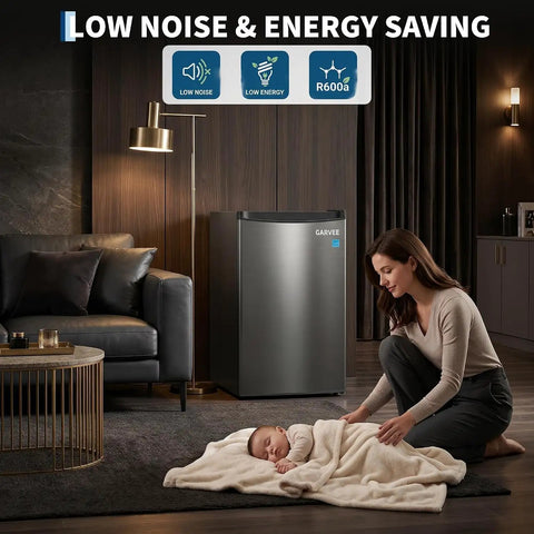 Dang Solid Upright Freezer 3.1 Cu Ft Single Door Vertical Deep Storage With Adjustable Shelves And Simple Mechanical Temp Control No Fuss Build For Garage Kitchen Or Basement In Slick Stainless Steel Finish next to a sleeping baby.