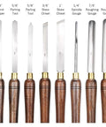 Dead Simple Wood Chisel Set Built Insanely Tough With High Carbon Steel Blades For Quick Wood Carving And Lathe Turning An Absolute Must Have Carpenter Gear Pack Kept Safe Inside A Classic Wooden Toolbox showing various wood chisels and tools.