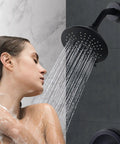 Woman showering with Black Shower Faucet Set With Brass Pressure Balance Valve And 6 Inch Rain Showerhead Wall Mount Trim Kit
