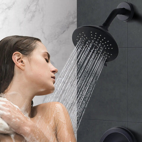 Woman showering with Black Shower Faucet Set With Brass Pressure Balance Valve And 6 Inch Rain Showerhead Wall Mount Trim Kit