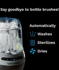 Front view of Baby Brezza Bottle Washer Pro in white with transparent chamber and visible baby brezza logo.