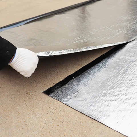 Premium Ultra Heavy Duty Self Adhesive Waterproof Roof Patch Tape For Asphalt Shingles And Leaks Hella Tough being applied.