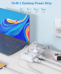 Snag This Game Changing Surge Protector Power Strip With Ten Foot Braided Extension Cord And Six Wide Spaced AC Outlets Plus Dual USB Ports For Plugging All Your Gear Up At The Dorm Or Apartment connected to a laptop and phone on a desk.