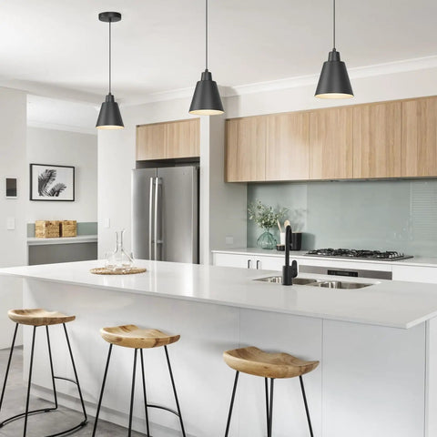 Top Tier Matte Black 3 Pack Pendant Lights For Kitchen Island Heavy Duty Metal Hanging Lamps with sleek design over wooden stools.