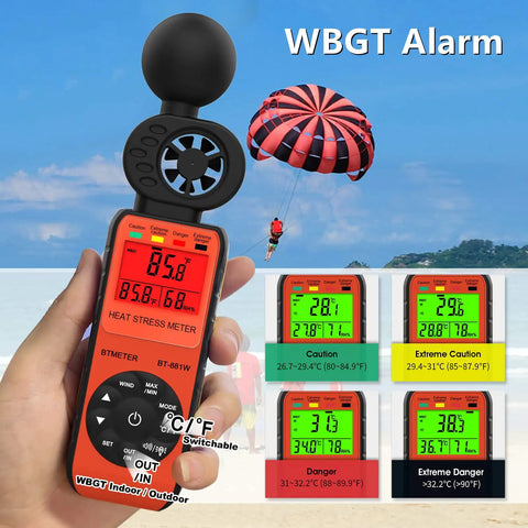 Handheld Heat Stress Meter And Anemometer With WBGT, Wind Speed 0 To 30 MPS, measuring at beach with parachute in background.