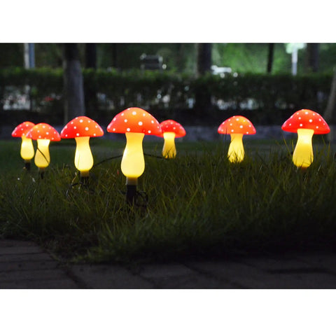 8 Pack Red Mushroom Solar Lights For Outdoor Garden Decor With 8 Lighting Modes illuminating a yard at night