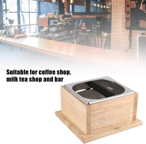 Top Shelf Stainless Steel Coffee Knock Box With Solid Wood Base Massive Grounds Bin at a coffee shop counter.