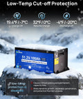 51.2V 100Ah rechargeable lithium-ion battery with low-temp cut-off protection shown in snowy environment.