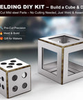 Welding DIY kit with a cube and dice made of pre-cut mild steel parts for easy assembly. Shown are finished projects on a table.