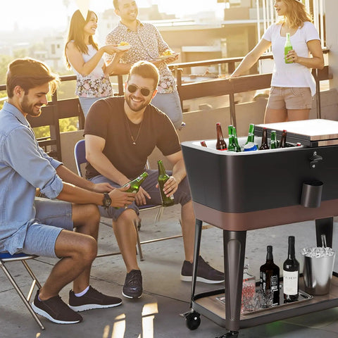 Group enjoying a party with an 80 Quart Rolling Patio Cooler Cart With Blackboard, Built In Bottle Opener on a rooftop deck.