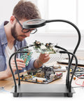 Four Arm Soldering Gear With 5X Magnifier And Light, PCB Holder And Third Hand Tool, Non Slip Steel Weighted Base in use on benchtop
