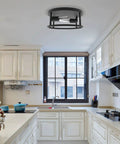 Matte Black Flush Mount Ceiling Light Two Light Fixture With E26 Base illuminating a modern kitchen with white cabinets.