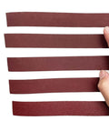Premium 8 Meter Sandpaper Rolls For Smooth Woodworking And Metal Grinding, versatile emery cloth pieces being held.