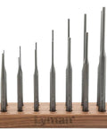 Dead Nuts Solid 18 Piece Hex Punch Set With Hardened Steel Bodies And A Compact Walnut Storage Block Includes Center Starter Pin Roll Punches arranged on wooden block.