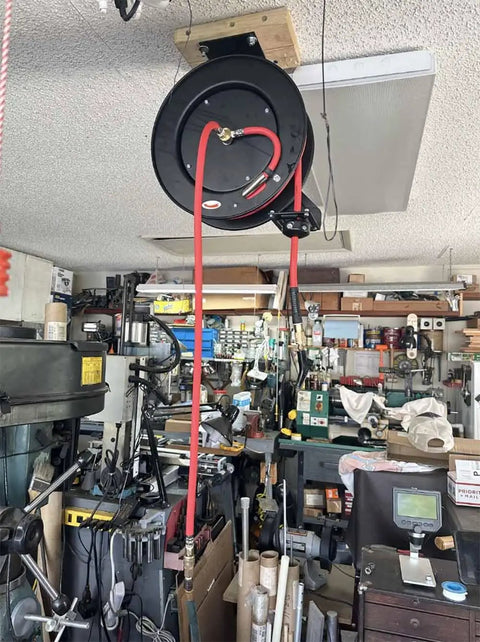 Retractable Air Hose Reel With Wall Or Ceiling Mount, Three Eighths Inch By Fifty Feet Hybrid Hose in garage, mounted on ceiling