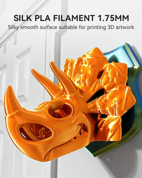 Orange 3D-printed triceratops skull made with Silk PLA Filament 1.75 mm for smooth, vibrant output mounted on a wall plaque.