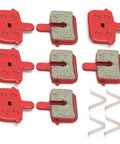 4 Pairs Resin Semi Metal Brake Pads Replacement For Electric Vehicles And Mountain Bikes Go To Quiet Braking With High Temperature Resistance And Long Wear For Smooth Stopping And Confident Rides Heavy Duty Performance, showing eight red and gray brake pads with springs, top view.