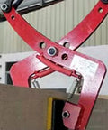Built Tough Universal Granite Slab Lifting Clamp gripping a granite slab with red alloy steel jaws for easy transport.