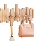 Dope Solid Wood Wall Mounted Coat Rack With Six Flip Down Hooks Magnetic For Each Hook Stays Vertical 16 Inch Wide holding handbag