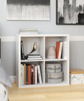 Four Cube Storage Shelf Organizer With Back Panel Easy Assembly Bookshelf in white wood finish with decor in home setting