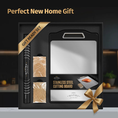Front view of Matiks stainless steel cutting board set in a gift box; 16×11 inch double-sided board with handle.