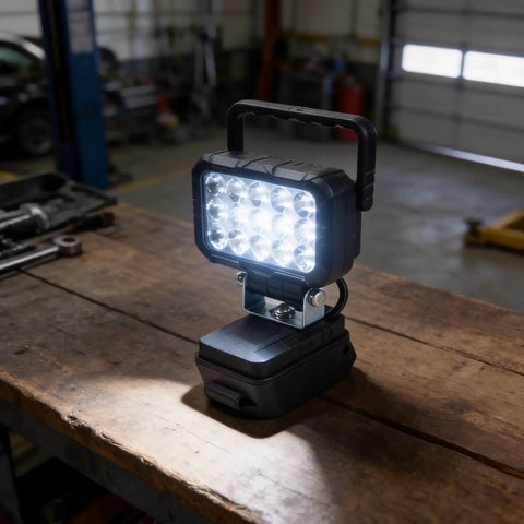 ABS Flood Light 15 LEDs Compatible with 18V Li-Ion Packs on a workbench in a workshop setting.