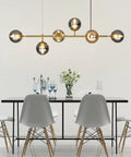 Modern Gold Pendant Lighting With Smoke Gray Glass Globes Adjustable 6-Light Hanging Ceiling Fixture in dining room