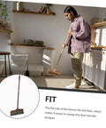 Long Handle Heavy Duty Broom With Soft Beveled Bristles For No Sweat Dust Removal And Quick Corner Cleanup Solid Workhorse Crushes Daily Kitchen Grime Indoors Or Outside Smooth Operator Approved; man using broom in kitchen to sweep dust