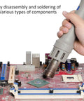 Person using 1000W Digital Display Hot Air Rework Station With Beefy Anti Static Control on a circuit board for soldering components.
