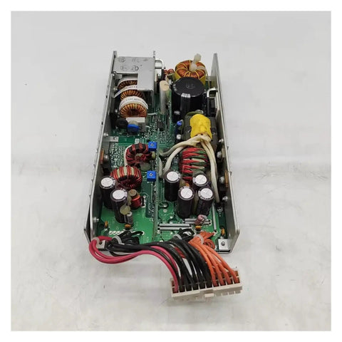 Beefy Switching Power Supply MPU150-3300S214 3.3V 35A 5V 20A With Porous Metal Case And Cooling Fan Low Noise Wide Input Range Stable Output Rugged Heat Dissipation For Industrial Electronics And DIY Projects. Open metal case with circuit board, coils, capacitors, and wire connector.