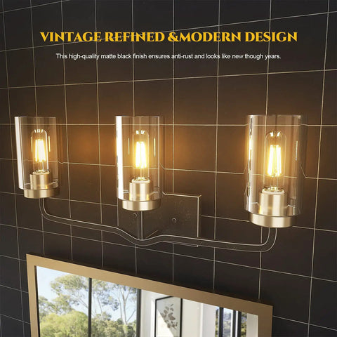 Lit Modern Bathroom Vanity Light Fixture in Matte Black, 3 light wall lamp with clear glass shades, mounted on black tile wall.