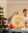Moon Lamp 7 Inch 3D Printed Moon Light With Stand, glowing near a Christmas tree with 7-inch size display.
