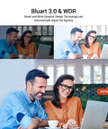 Two people smiling at a laptop while enjoying coffee, showcasing the Bluart 3.0 & WDR lighting adjustment feature.