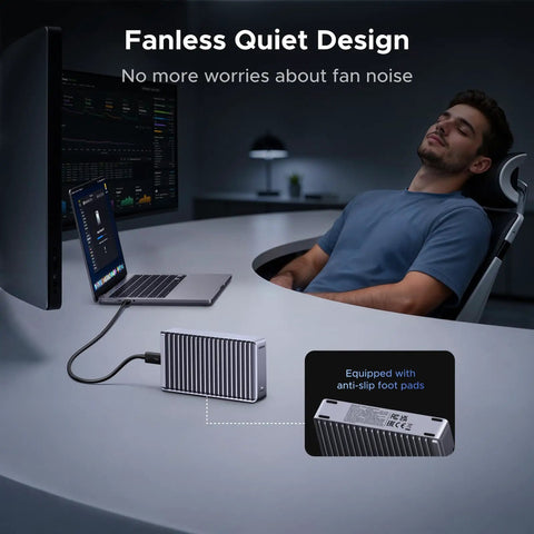 Beast Mode M.2 NVMe SSD Enclosure With 80Gbps Thunderbolt Ports and Dual Chip Architecture on a desk with a laptop.