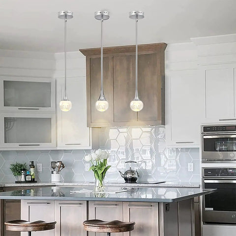 Mini Pendant Light With Dope Teardrop Crystal Jellyfish Pattern, Chrome Finish, 5W LED in kitchen setting with bar stools.