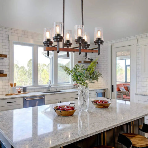 Six Light Rustic Wagon Wheel Chandelier With Hemp Rope And Seeded Glass Shades over kitchen island.