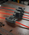 Heavy Duty Automotive Replacement Fuse Holders Waterproof Pvc Shell with red wires on wooden table for vehicle wiring systems.