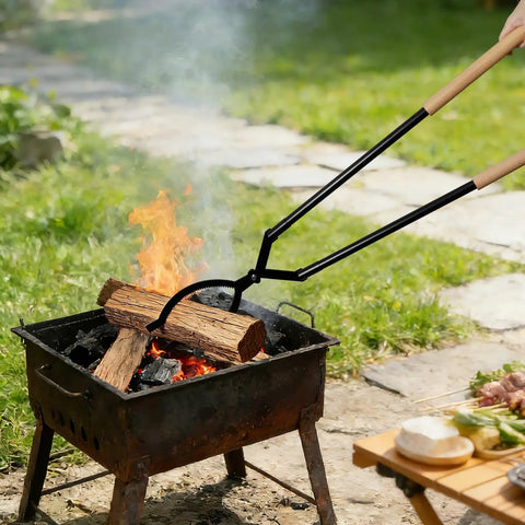 Using 42 Inch Detachable Fire Tongs And Poker Set With Carrying Bag to adjust logs in outdoor bonfire, shown in use.