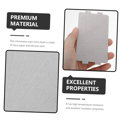 Hand holding a microwave mica sheet with text highlighting premium material and properties for 30 Pcs Oven Mica Plates And Microwave Mica Sheets Heat Insulation Covers For Microwave Reusable Accessory Must Have Kitchen Gadget Durable Waveguide Cover Replacement For Home Ovens And Appliances.